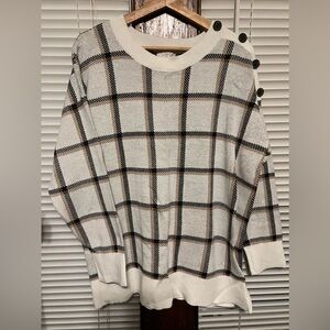 Neutral plaid 3/4 sleeve sweater with button detailed shoulder.